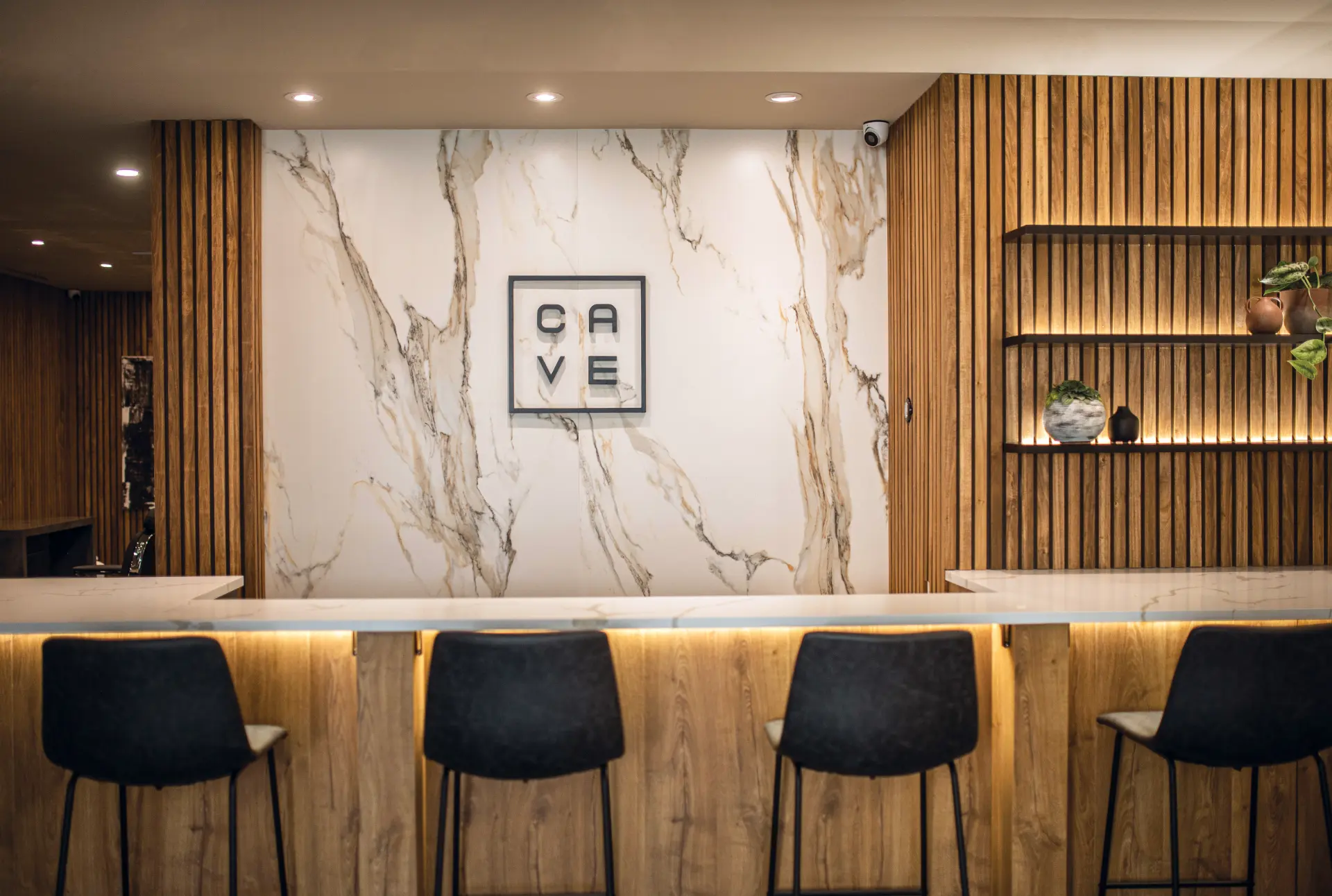 CAVE hospitality counter and marble feature wall